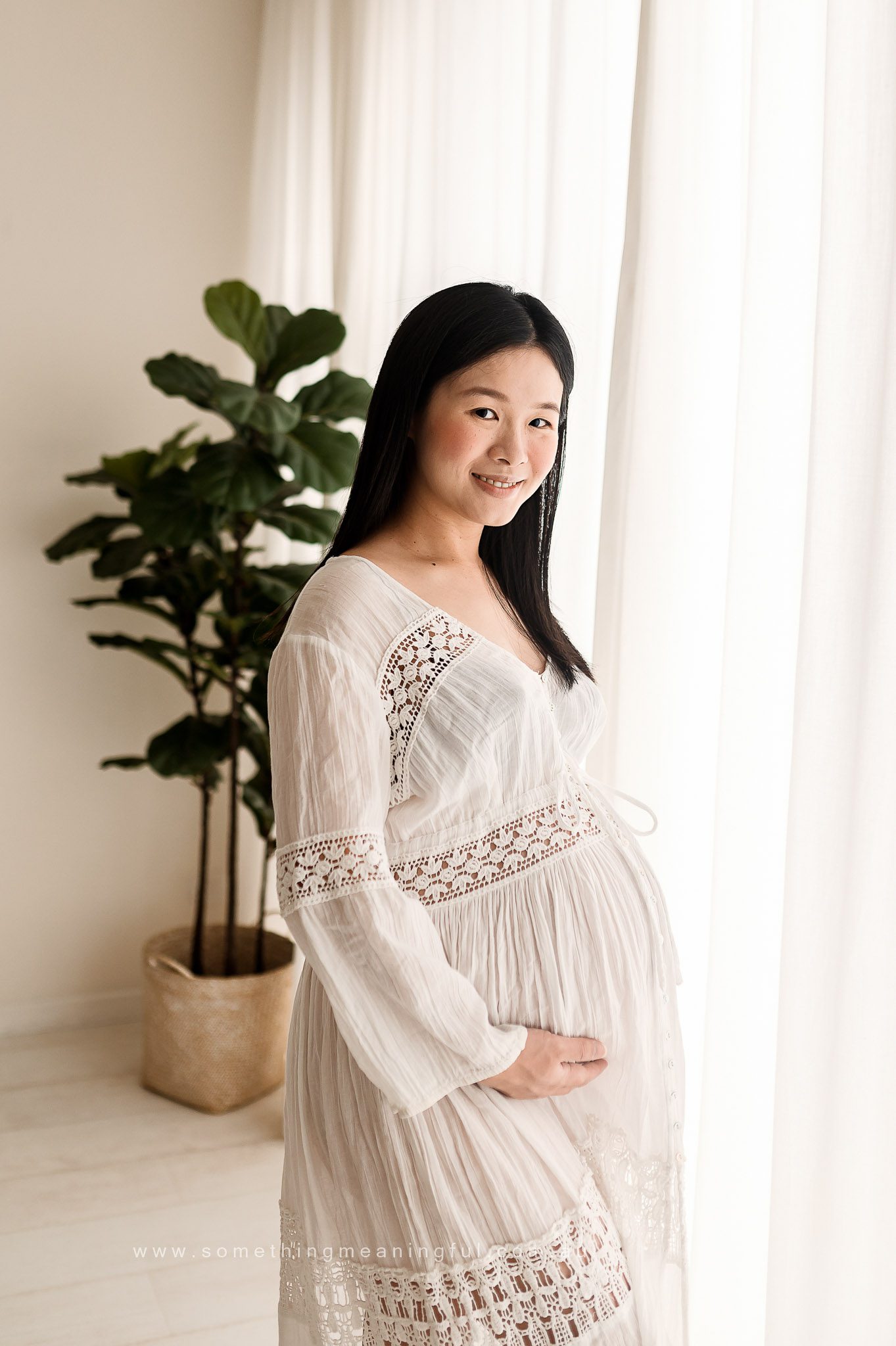 Cozy studio setup for Maternity Photography Session, offering a warm and intimate atmosphere for capturing precious moments."